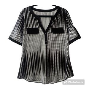 Size Large women’s top Light material, short sleeve, loose. Casual or business.